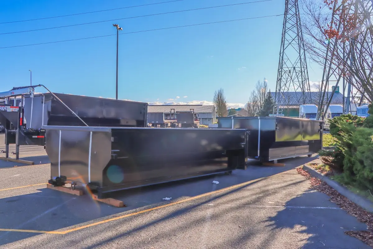 Roll-off dumpster ready for waste disposal at job site for Roofing Dumpster Rental in Woodstock
